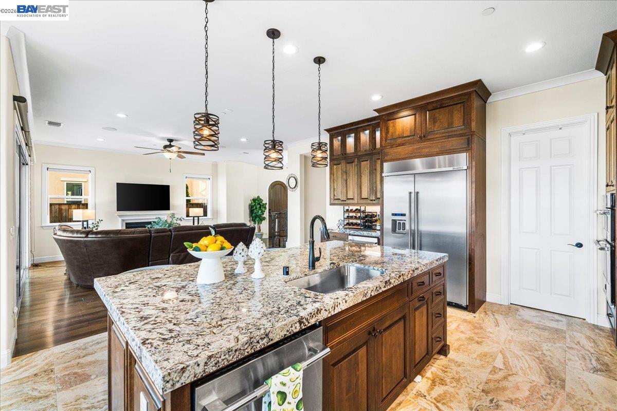 205 Zinnia Court San Ramon, CA 94582 - Photo 14 of 40 a kitchen with granite countertop a sink and a wooden floor
