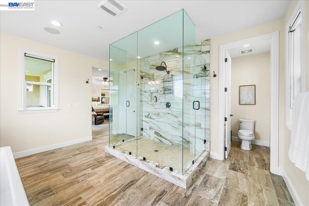 205 Zinnia Court San Ramon, CA 94582 - Photo 26 of 40 a bathroom with a double vanity sink toilet and shower
