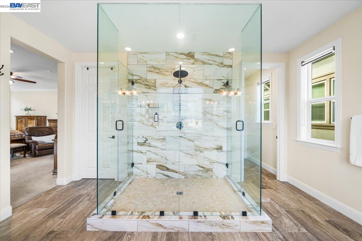 205 Zinnia Court San Ramon, CA 94582 - Photo 27 of 40 a bathroom with a tub shower and sink