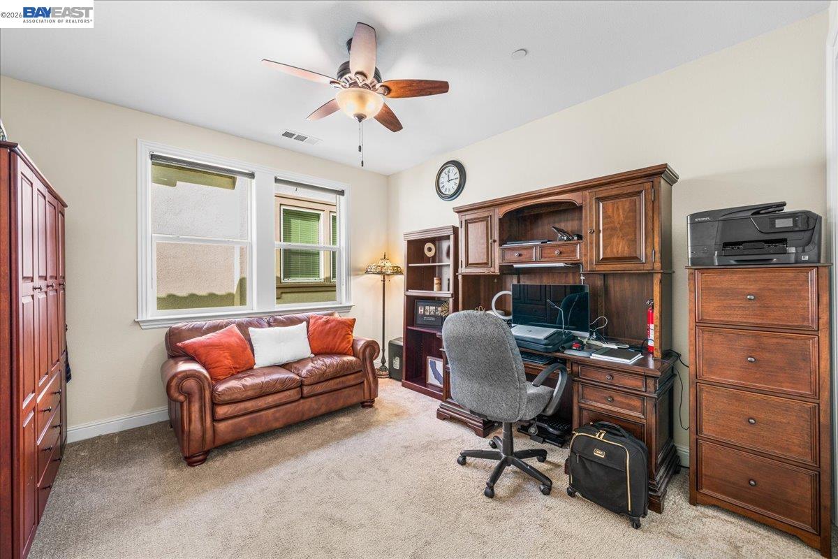 205 Zinnia Court San Ramon, CA 94582 - Photo 28 of 40 a living room with furniture and a flat screen tv