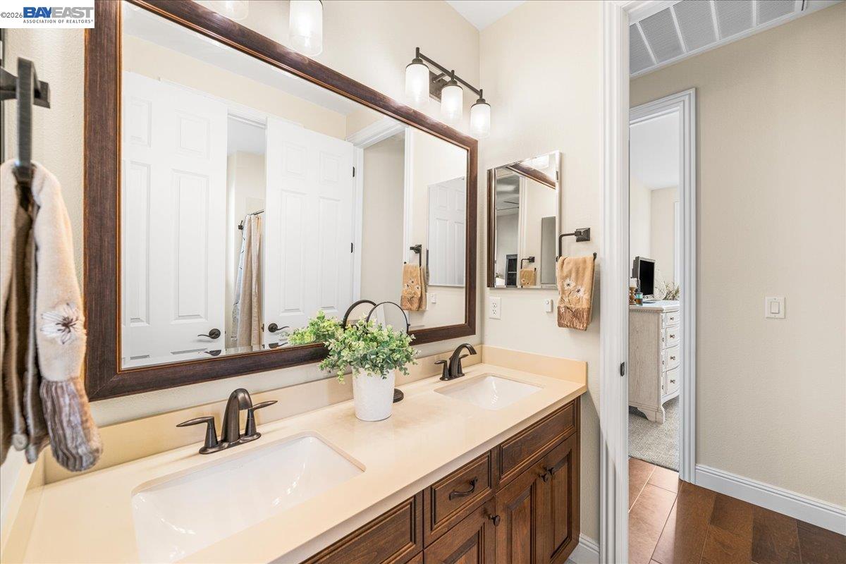 205 Zinnia Court San Ramon, CA 94582 - Photo 30 of 40 a bathroom with a sink and a mirror