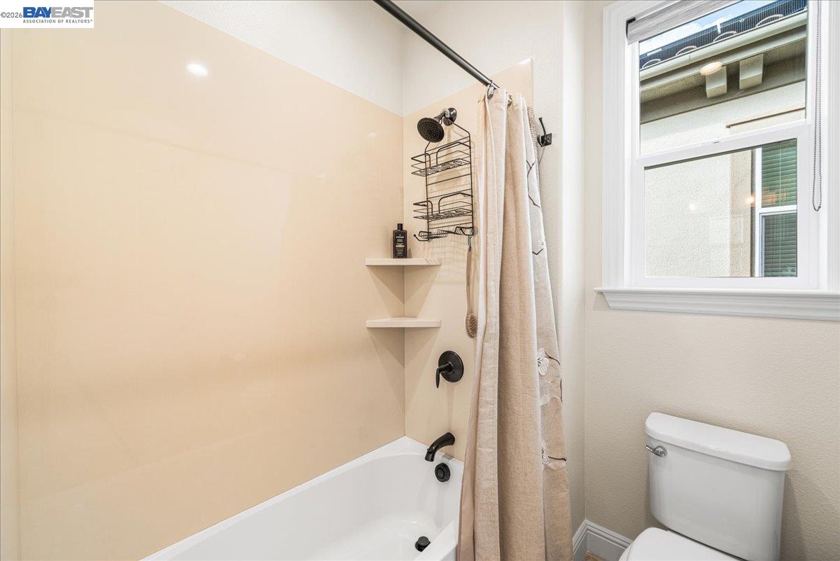 205 Zinnia Court San Ramon, CA 94582 - Photo 32 of 40 a bathroom with a shower and a toilet