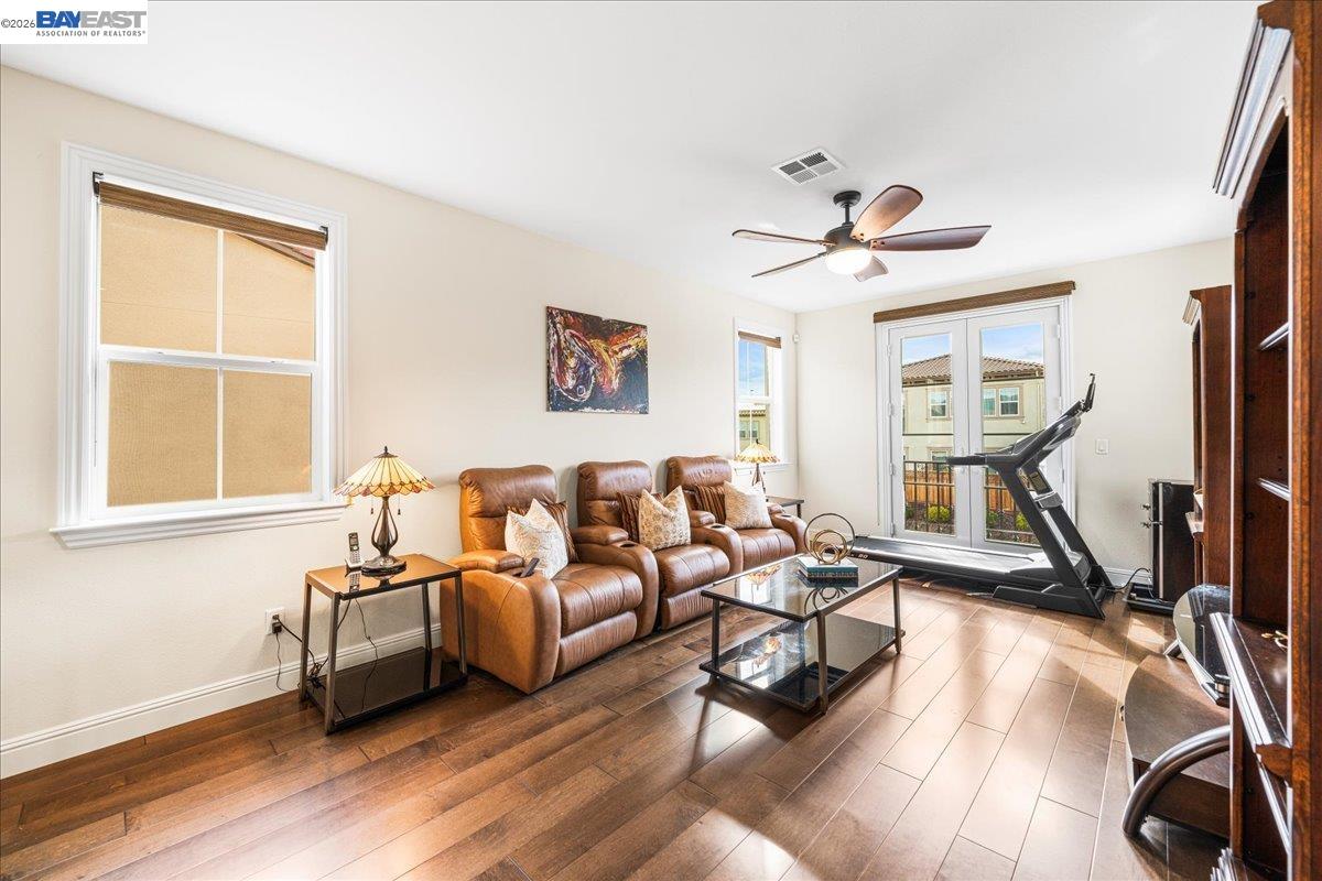 205 Zinnia Court San Ramon, CA 94582 - Photo 36 of 40 a living room with furniture a flat screen tv and a large window