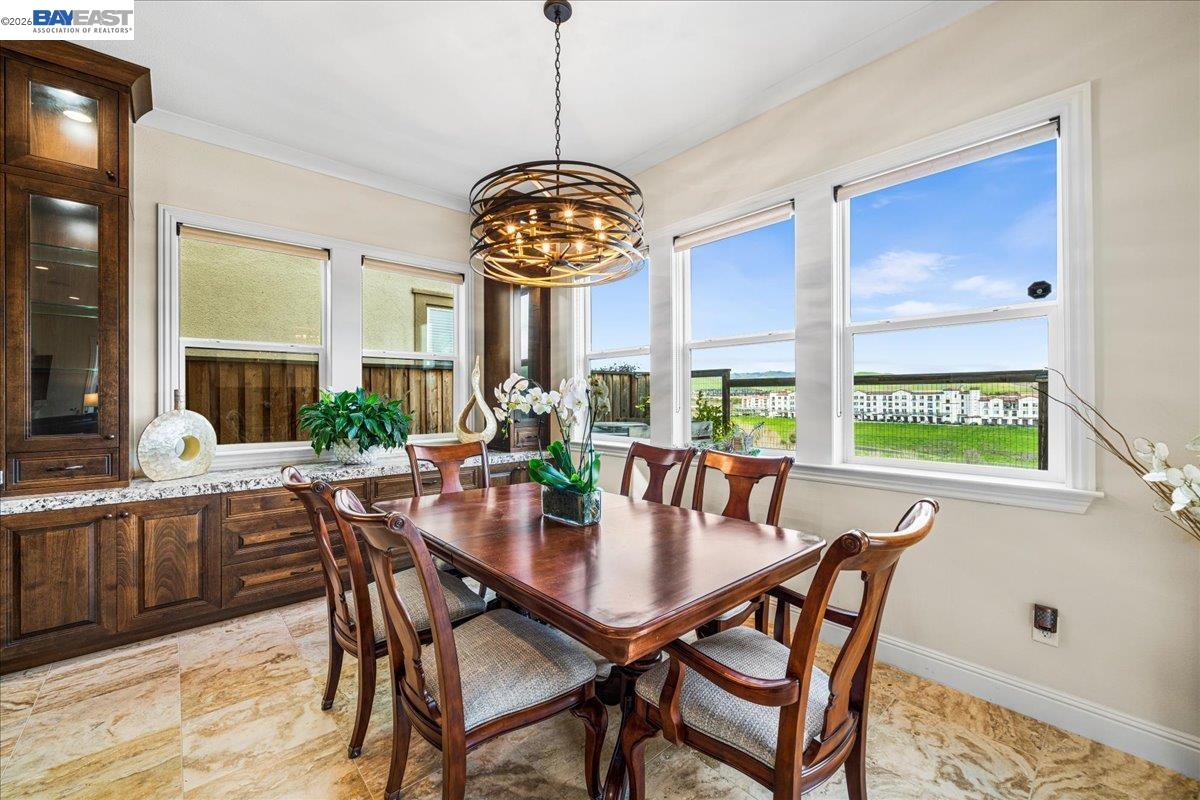 205 Zinnia Court San Ramon, CA 94582 - Photo 5 of 40 a view of a dining room and livingroom with furniture wooden floor and a chandelier
