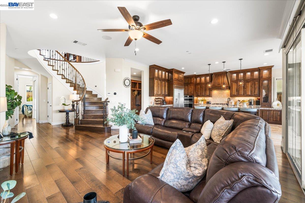 205 Zinnia Court San Ramon, CA 94582 - Photo 8 of 40 a living room with furniture kitchen view and a wooden floor