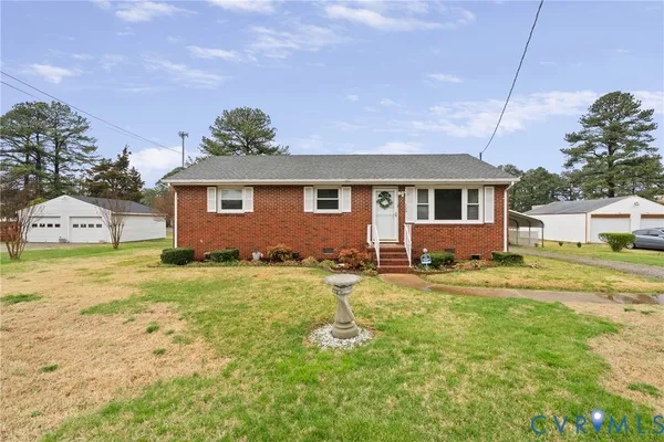 a view of a house with a backyard