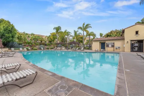 a view of a swimming pool with a patio