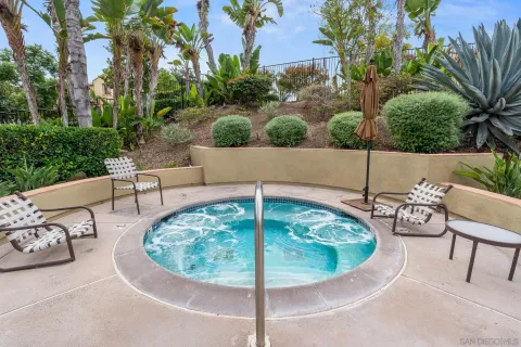 a view of a swimming pool with a lounge chairs