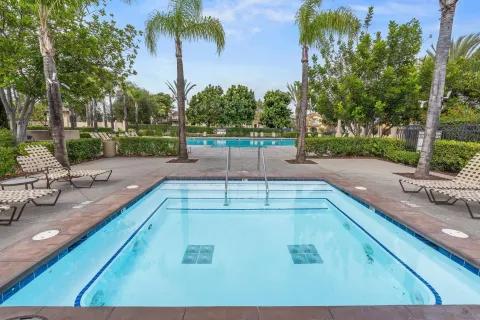 a view of a swimming pool with a patio
