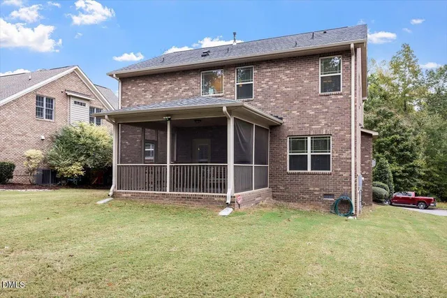 a view of a house with a yard and garage