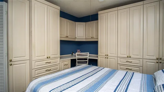 a view of a closet with wooden floor