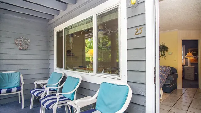 a view of a room with furniture and a window