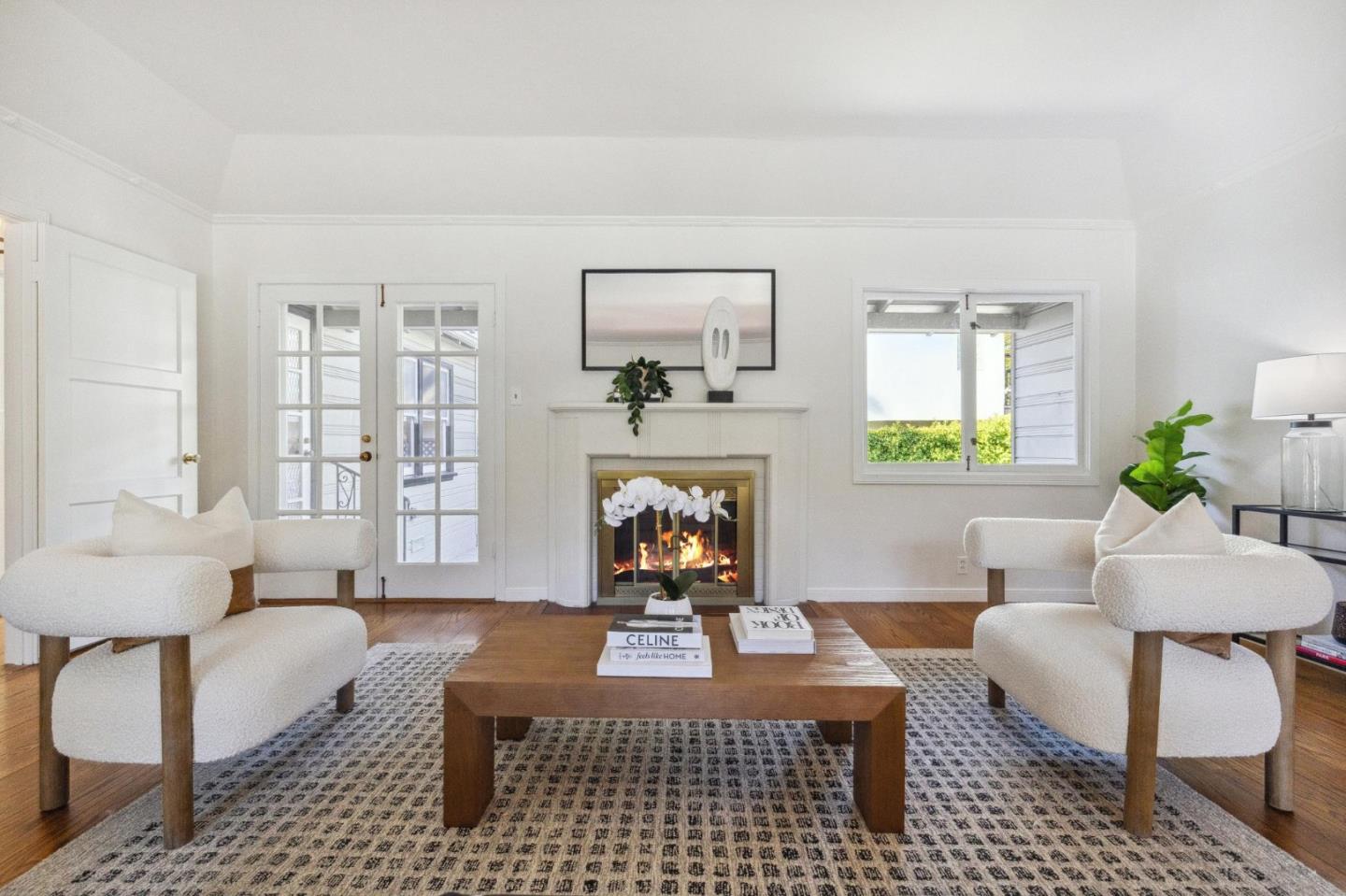 1820 Broadway Burlingame, CA 94010 - Photo 11 of 55 a living room with furniture a fireplace and a table
