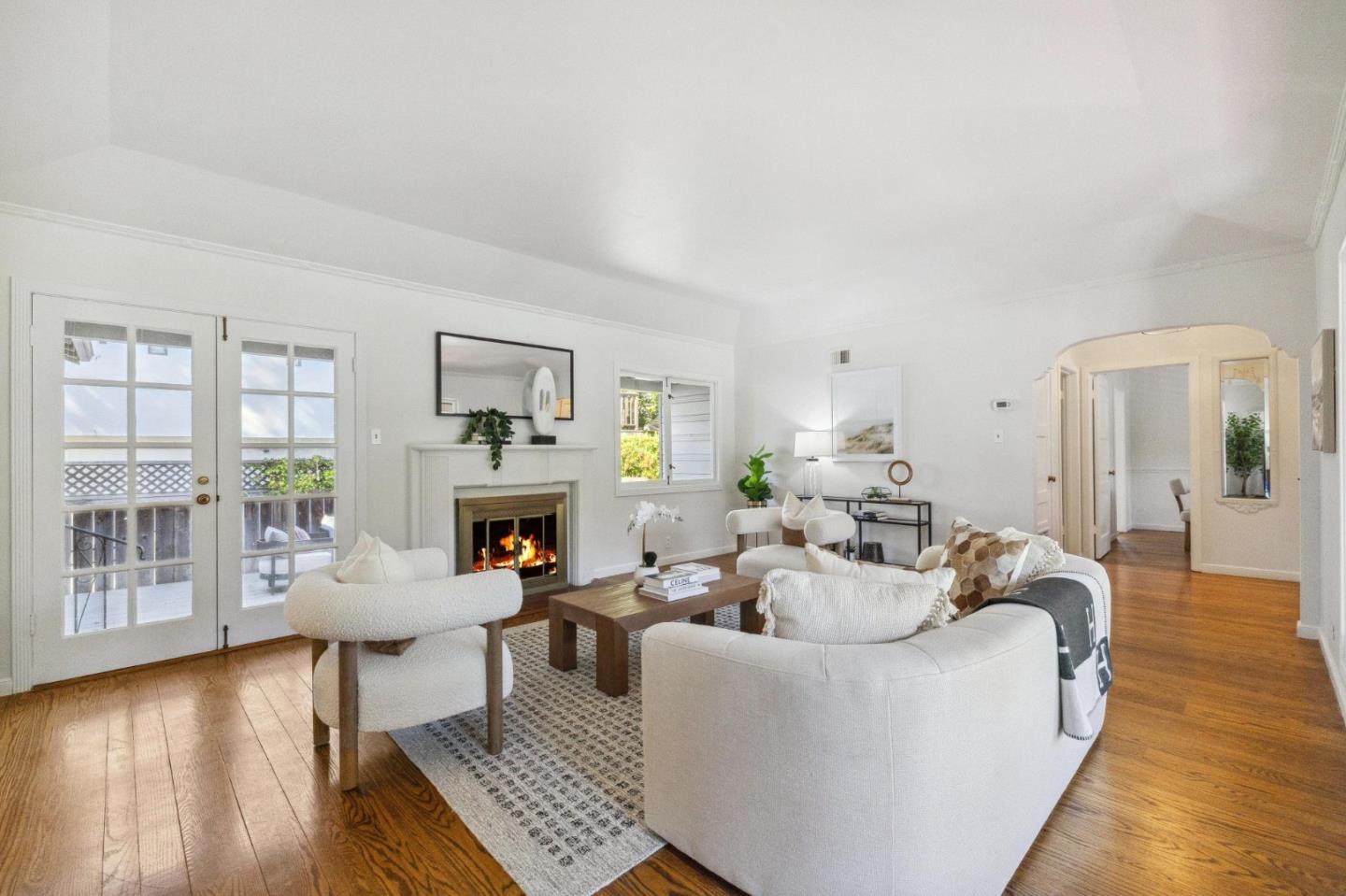 1820 Broadway Burlingame, CA 94010 - Photo 12 of 55 a living room with fireplace furniture and a wooden floor