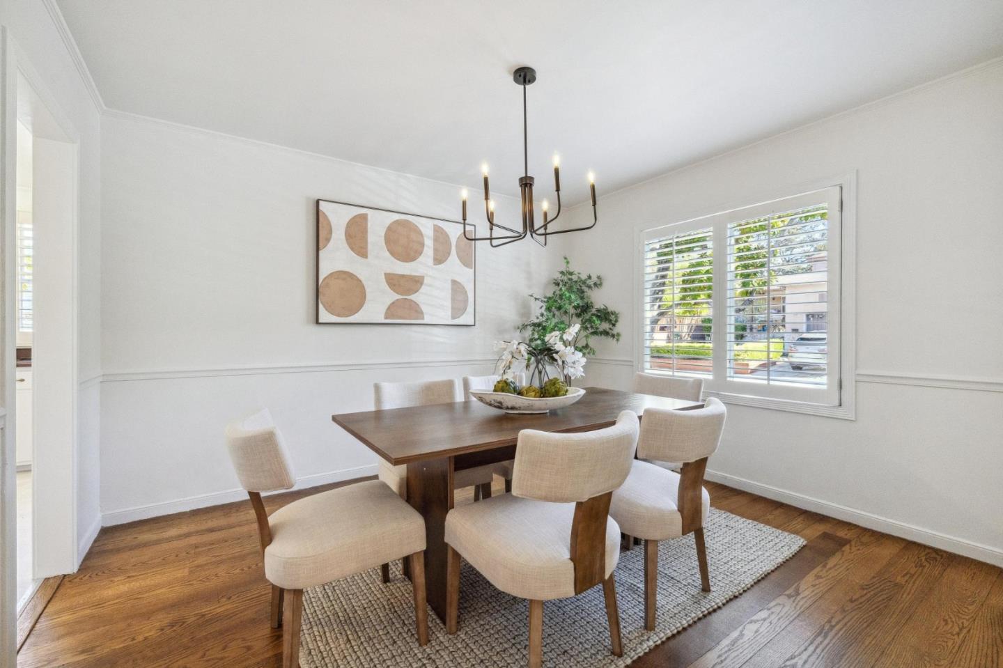 1820 Broadway Burlingame, CA 94010 - Photo 17 of 55 a view of a dining room with furniture window and wooden floor