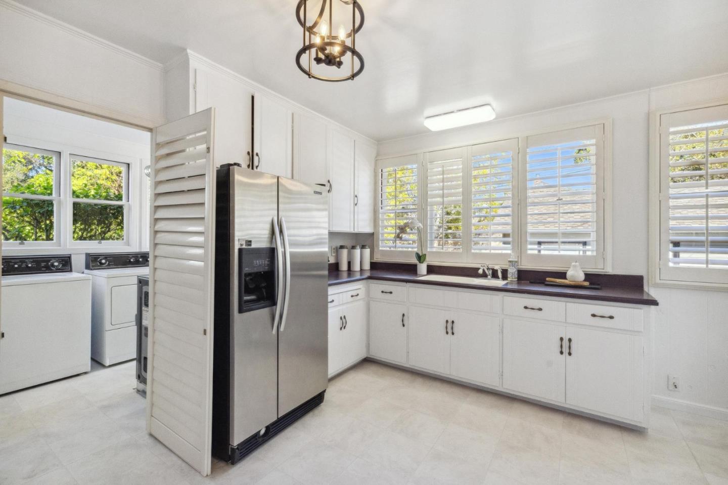 1820 Broadway Burlingame, CA 94010 - Photo 21 of 55 a kitchen with granite countertop stainless steel appliances a counter space and a window