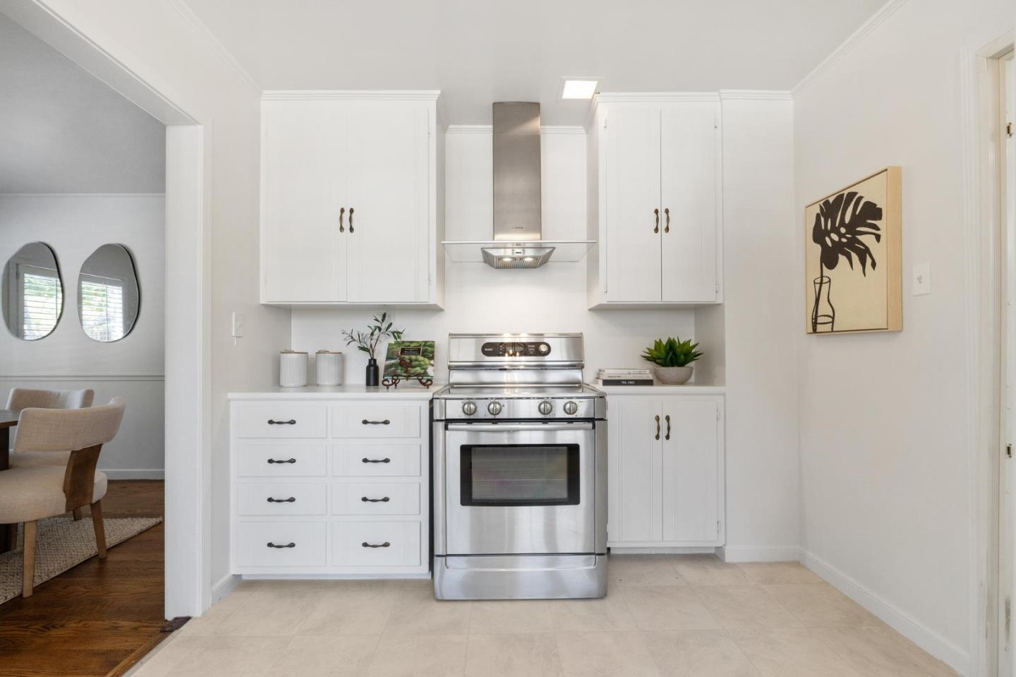 1820 Broadway Burlingame, CA 94010 - Photo 22 of 55 a kitchen with granite countertop white cabinets and white appliances