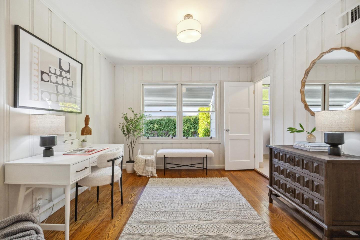 1820 Broadway Burlingame, CA 94010 - Photo 27 of 55 a spacious bedroom with a bed a table and a large window