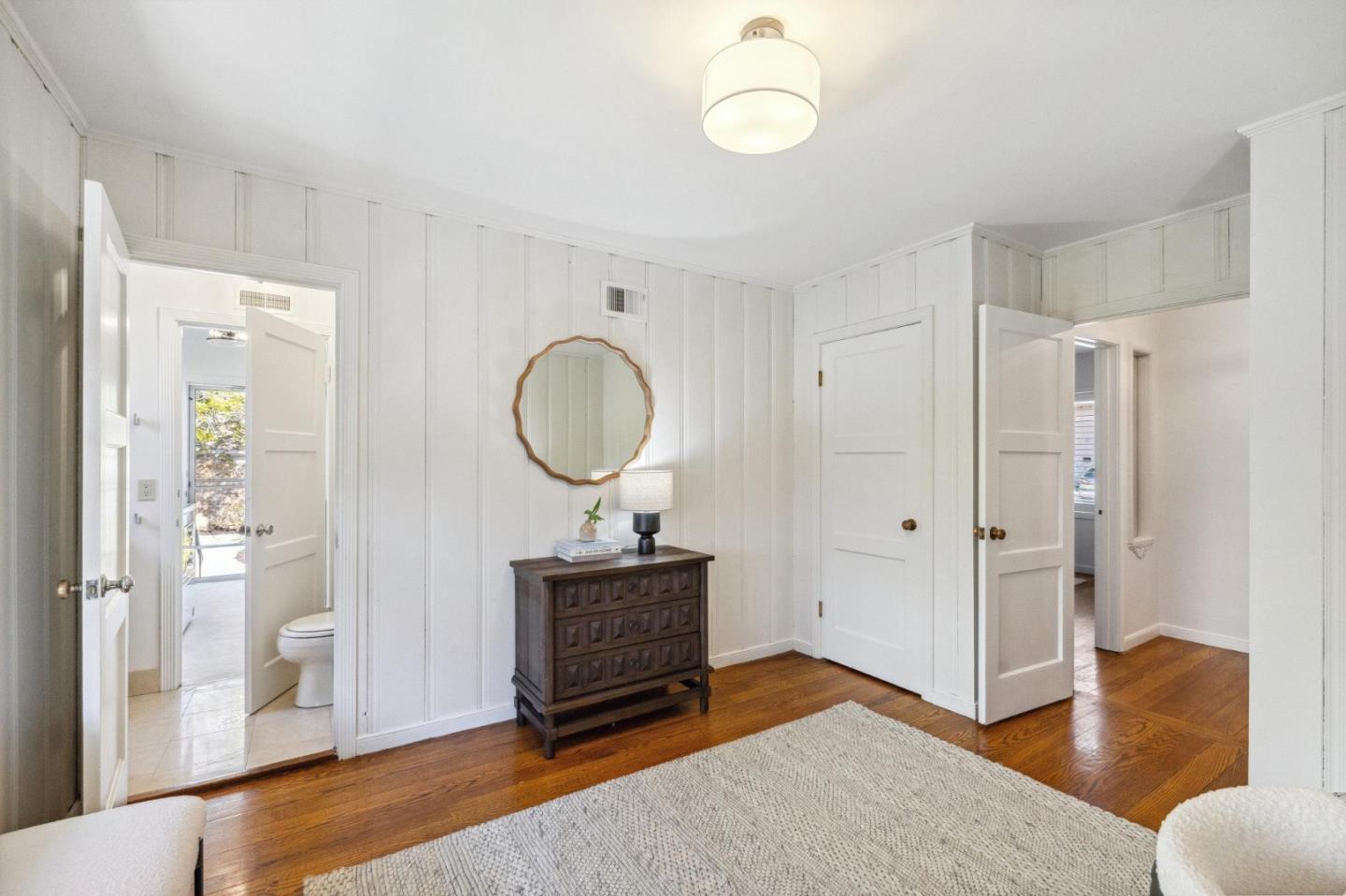 1820 Broadway Burlingame, CA 94010 - Photo 30 of 55 a living room with a mirror furniture and a window