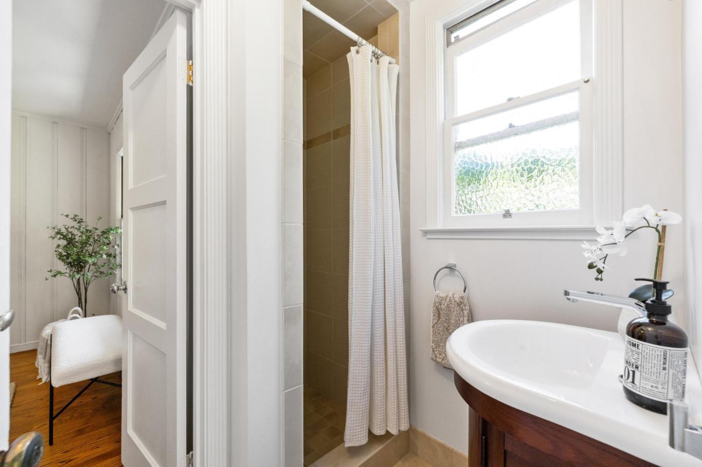 1820 Broadway Burlingame, CA 94010 - Photo 31 of 55 a bathroom with a sink and a window