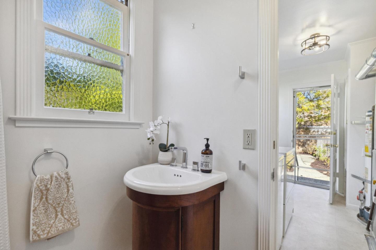 1820 Broadway Burlingame, CA 94010 - Photo 32 of 55 a bathroom with a sink a mirror and a toilet