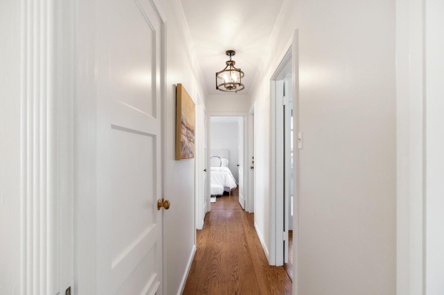 1820 Broadway Burlingame, CA 94010 - Photo 33 of 55 a view of a hallway with wooden floor and staircase
