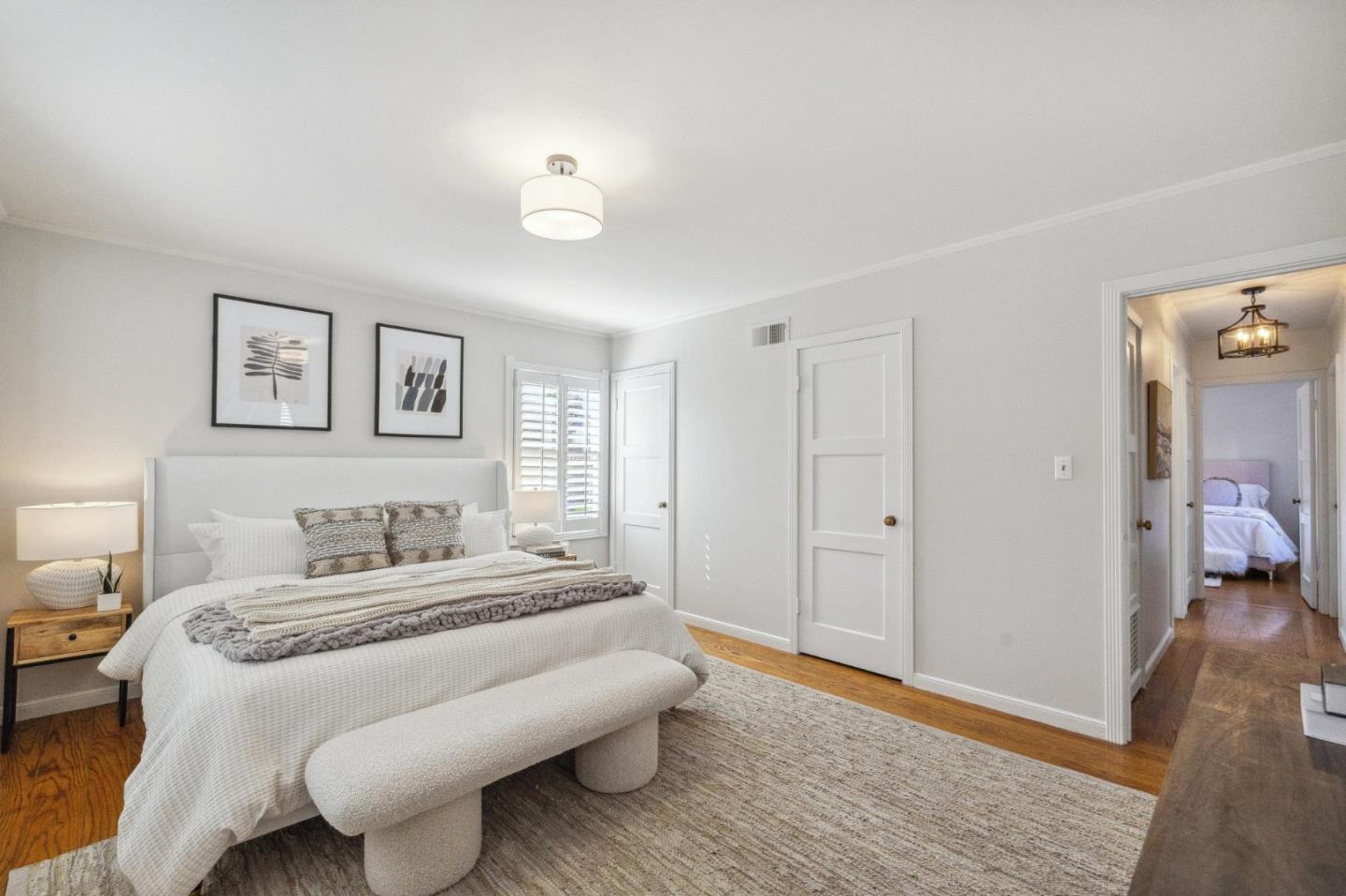 1820 Broadway Burlingame, CA 94010 - Photo 36 of 55 a bedroom with a bed and a chandelier