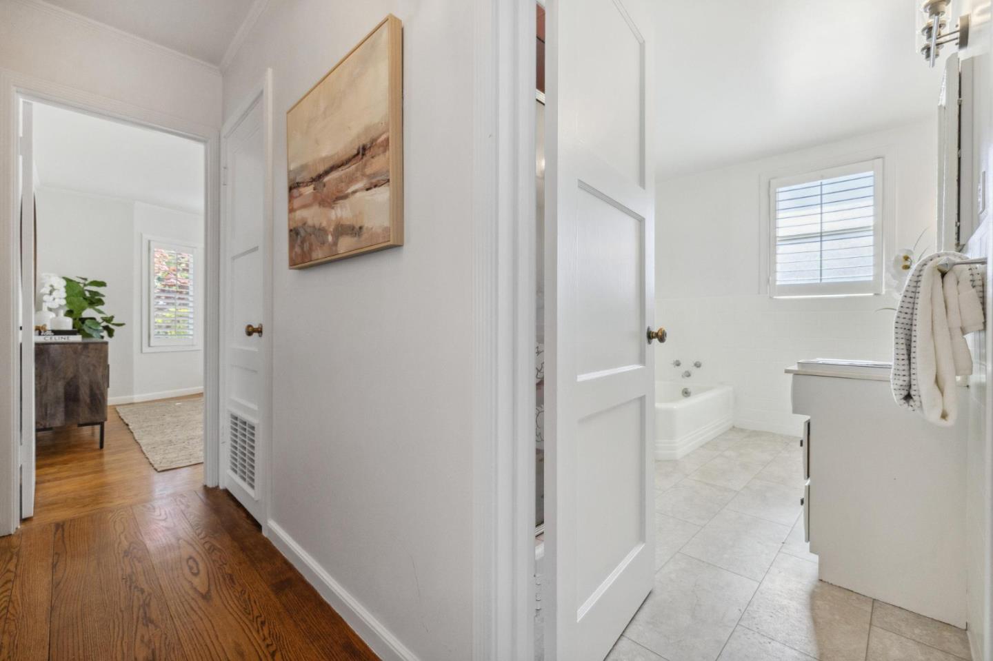 1820 Broadway Burlingame, CA 94010 - Photo 41 of 55 a view of a hallway with wooden floor and a living room