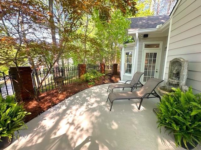 7155 Roswell Road, Unit 40 Sandy Springs, GA 30328 - Photo 35 of 42 a view of a patio with chairs and potted plants