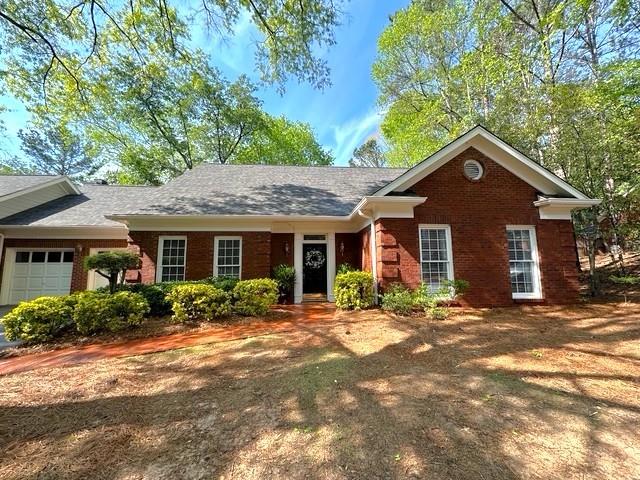 7155 Roswell Road, Unit 40 Sandy Springs, GA 30328 - Photo 37 of 42 a front view of a house with a yard