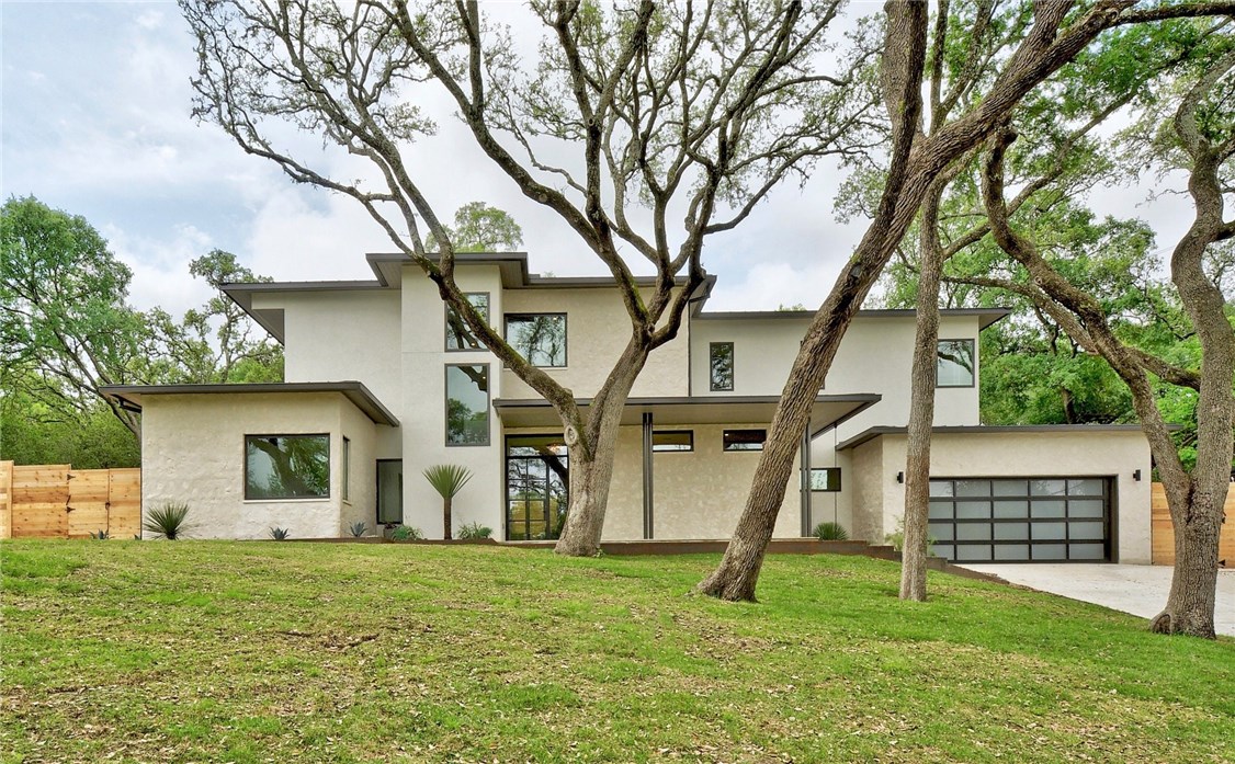 405 Brookhaven Trail Austin, TX 78746 - Photo 1 of 1 a view of a house with a yard