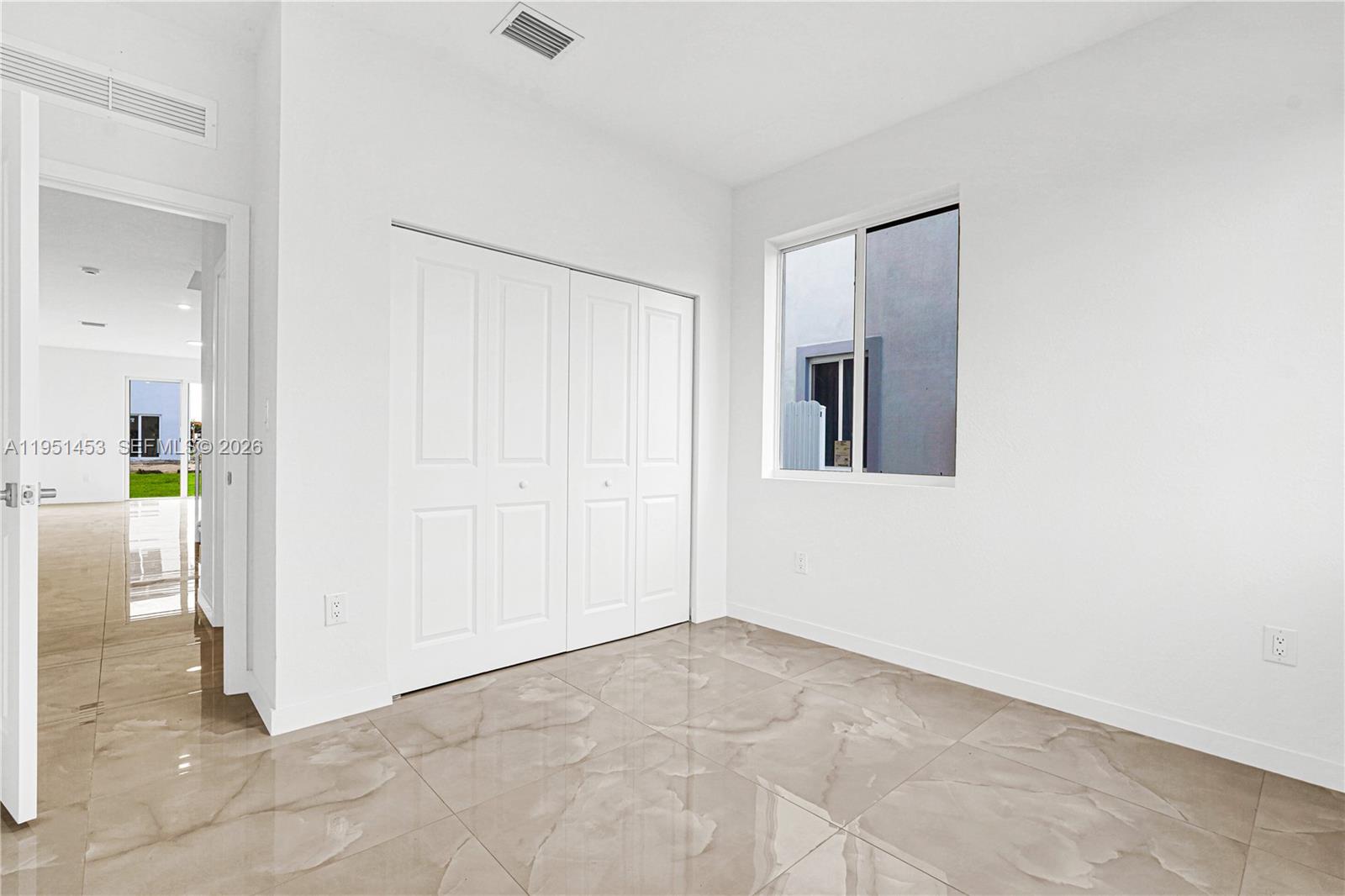 22431 Southwest 125th Avenue, Unit 19B Homestead, FL 33033 - Photo 15 of 40 a view of an empty room