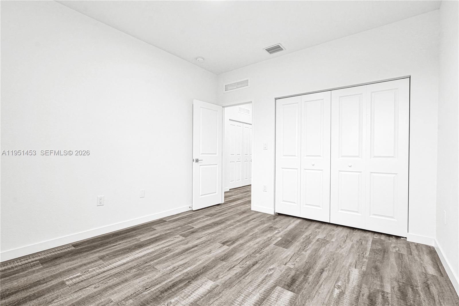 22431 Southwest 125th Avenue, Unit 19B Homestead, FL 33033 - Photo 20 of 40 a view of a room with wooden floor