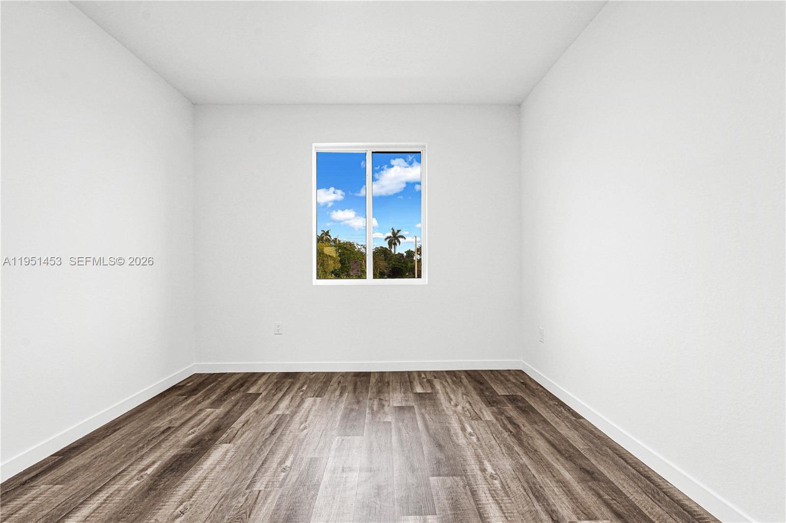 22431 Southwest 125th Avenue, Unit 19B Homestead, FL 33033 - Photo 25 of 40 a view of empty room with wooden floor
