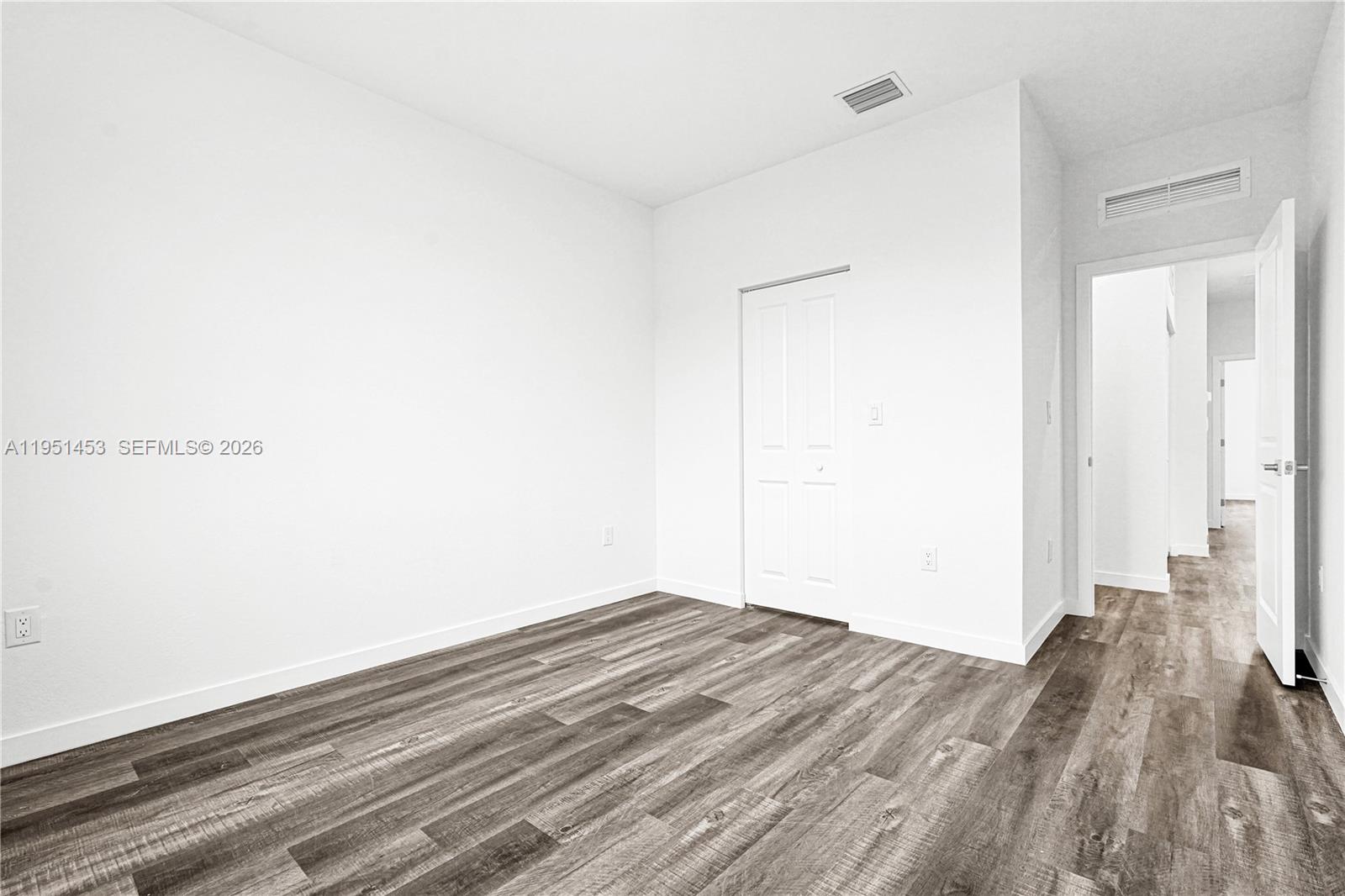 22431 Southwest 125th Avenue, Unit 19B Homestead, FL 33033 - Photo 27 of 40 a view of a room with wooden floor