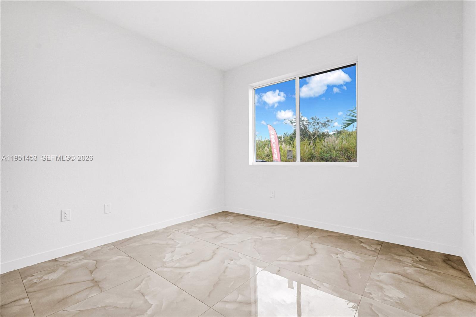 22431 Southwest 125th Avenue, Unit 19B Homestead, FL 33033 - Photo 8 of 40 an empty room with a window