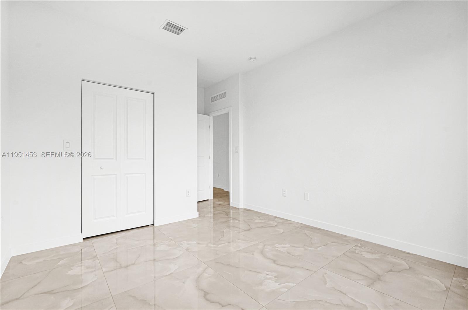 22431 Southwest 125th Avenue, Unit 19B Homestead, FL 33033 - Photo 9 of 40 a view of an empty room