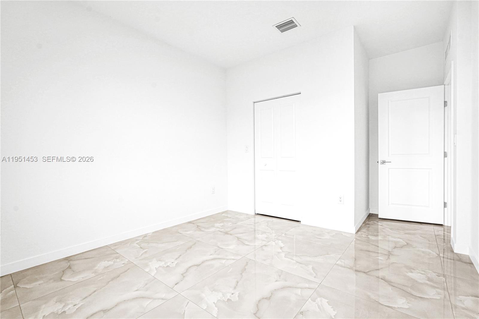 22431 Southwest 125th Avenue, Unit 19B Homestead, FL 33033 - Photo 10 of 40 a view of an empty room