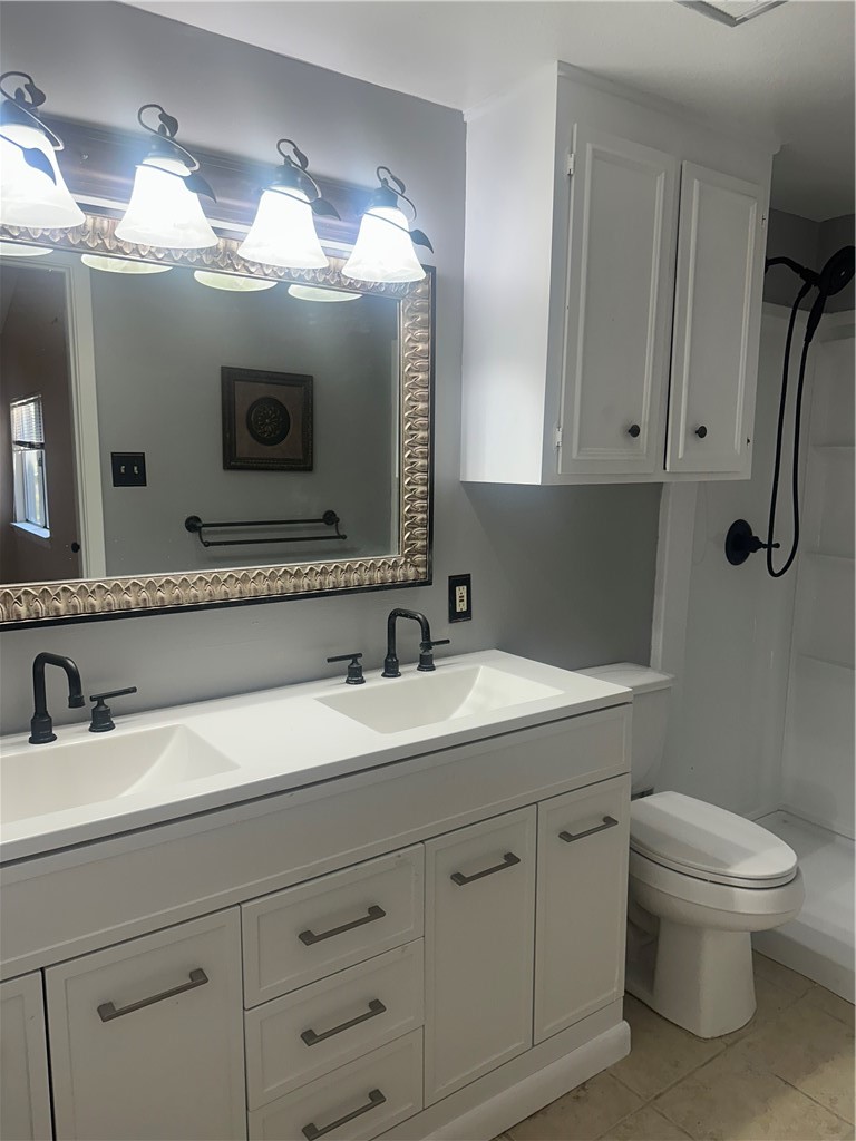 4032 Ogrady Drive Corpus Christi, TX 78413 - Photo 13 of 18 a bathroom with a sink and a mirror