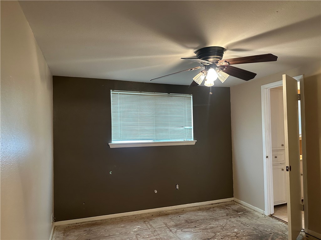 4032 Ogrady Drive Corpus Christi, TX 78413 - Photo 16 of 18 a view of a livingroom with a ceiling fan and window
