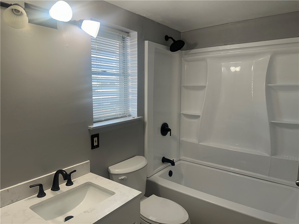 4032 Ogrady Drive Corpus Christi, TX 78413 - Photo 17 of 18 a bathroom with a sink toilet and shower