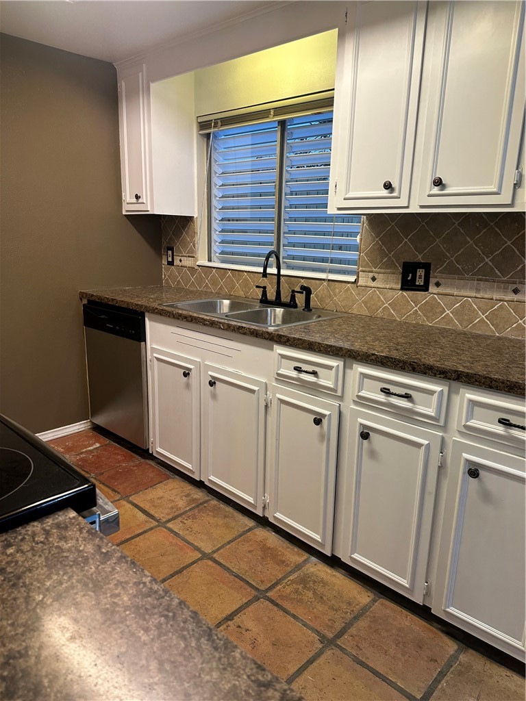 4032 Ogrady Drive Corpus Christi, TX 78413 - Photo 8 of 18 a kitchen with granite countertop white cabinets and white appliances