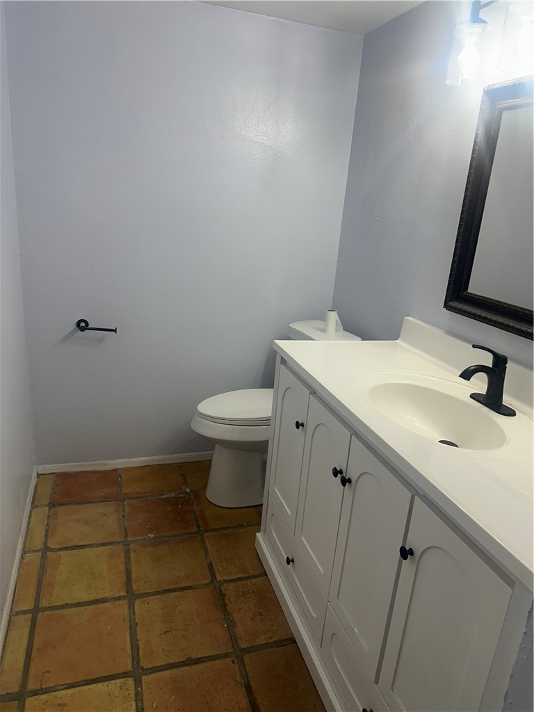 4032 Ogrady Drive Corpus Christi, TX 78413 - Photo 10 of 18 a bathroom with a sink toilet and mirror