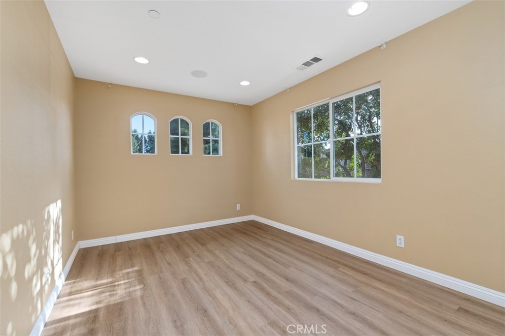 40 League Irvine, CA 92602 - Photo 22 of 38 a view of empty room with wooden floor and fan