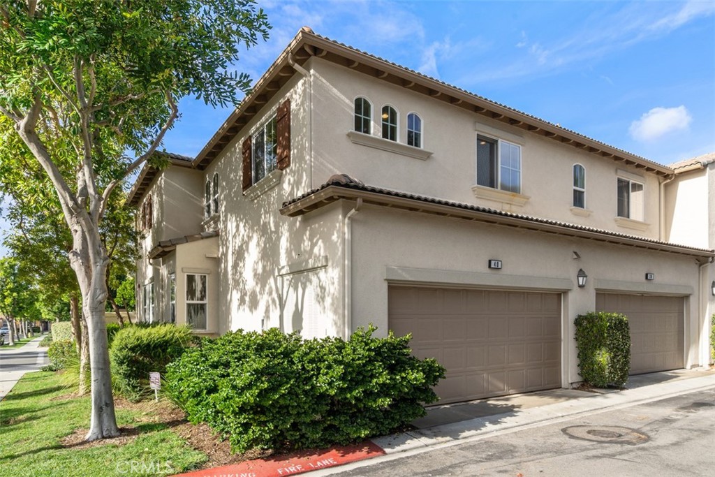 40 League Irvine, CA 92602 - Photo 23 of 38 a front view of a house with a yard