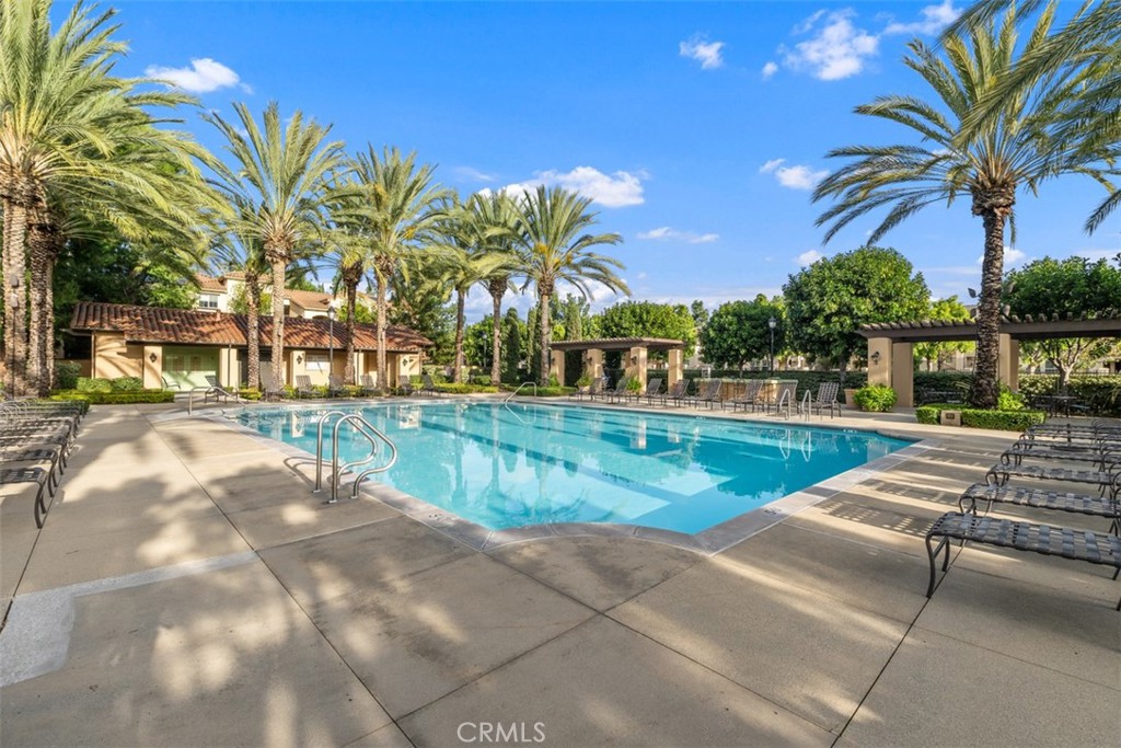 40 League Irvine, CA 92602 - Photo 27 of 38 a view of swimming pool with a table and chairs