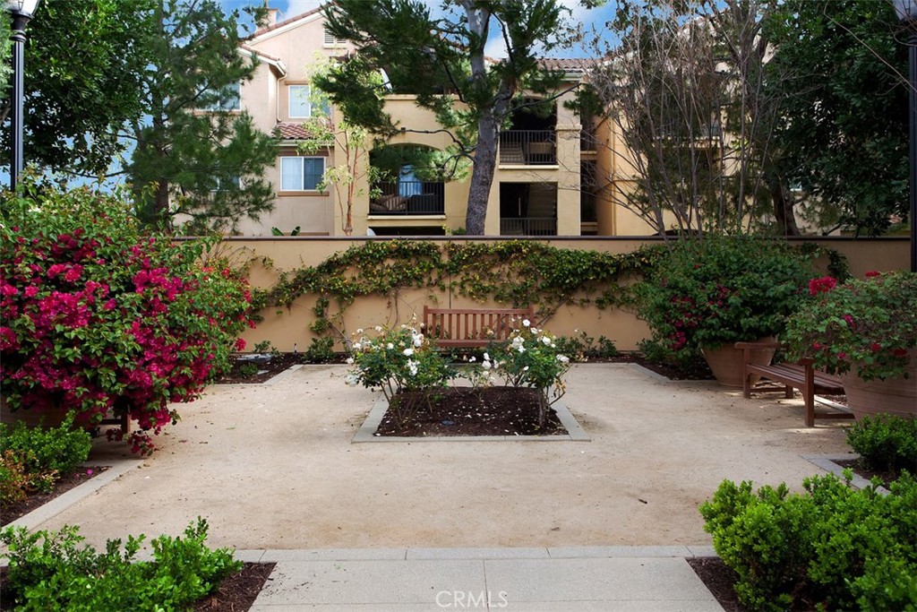 40 League Irvine, CA 92602 - Photo 34 of 38 a front view of a house with a yard and a garden