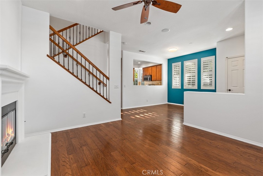 40 League Irvine, CA 92602 - Photo 4 of 38 a view of a livingroom with wooden floor and a ceiling fan