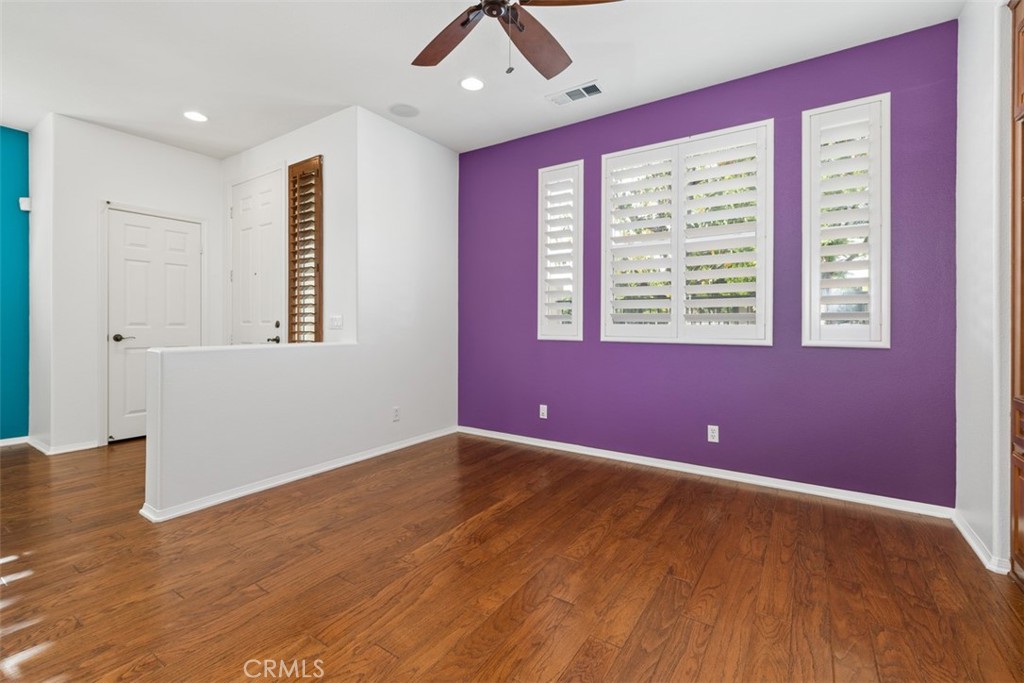 40 League Irvine, CA 92602 - Photo 6 of 38 a view of an empty room with a window and wooden floor