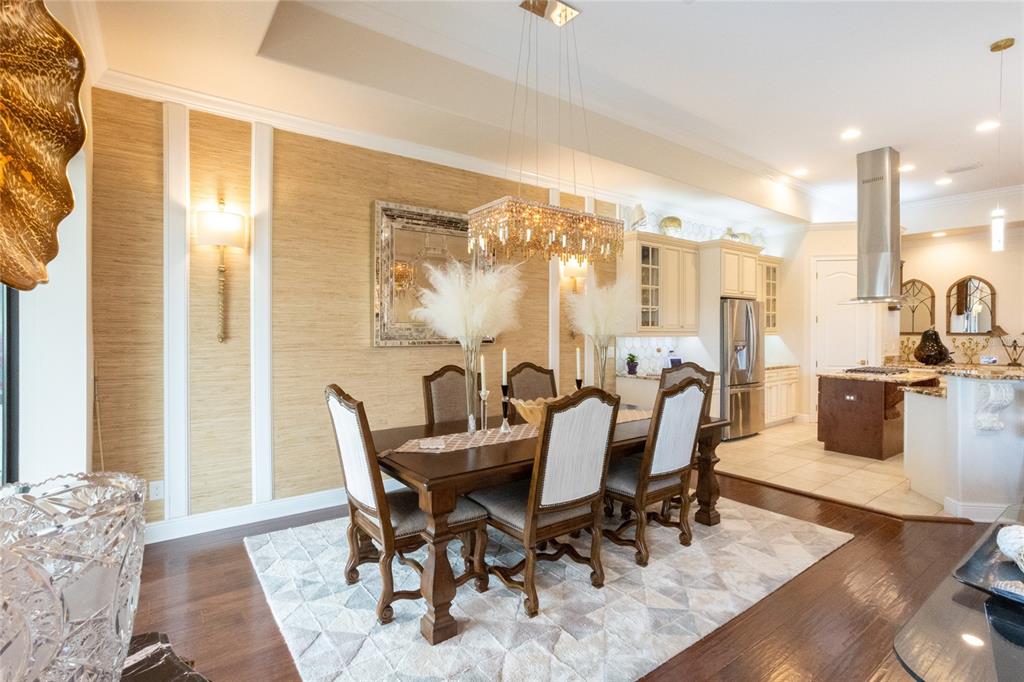 105 Wimbledon Court Redington Shores, FL 33708 - Photo 14 of 64 a view of a dining room with furniture window and wooden floor
